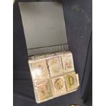 Album of good Edwardian postcards, military, Christmas, silks, birthday wishes, comical and novelty,