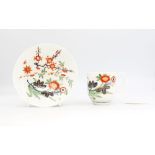 A Worcester porcelain polychrome coffee cup and saucer, painted with a variation of The Kempthorne