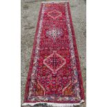 A North West Persian runner, 300 x 80cm.