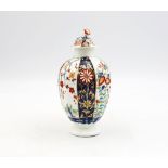 A Worcester porcelain polychrome tea canister and cover, decorated with The Queens pattern. Circa