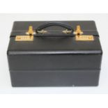 A large Asprey black leather cantilever jewellery box, having gilt metal combination locks,