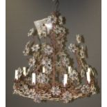 A contemporary Vaughan Fleville eight light wrought metal and applied glass flowerhead
