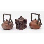 Three Yixing including a 19th Century reticulated teapot, all with covers and marks to bases.