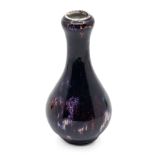 A Chinese Jun glazed bottle shaped vase, probably late Qing dynasty, approx. 15cm high. Further