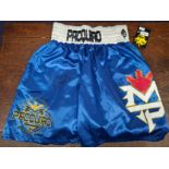 Attributed to Manny 'Pacman' Pacquiao; a pen signed pair blue silk boxing shorts
