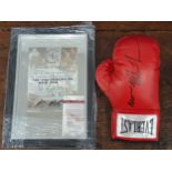 A signed boxing glove in case; reported signed by Mike Tyson with certificate