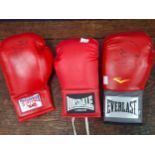 Two unattributed signed Longdale boxing gloves; together with an Everlast signed boxing glove (3)