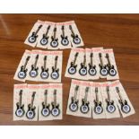 A collection of The Beatles Guitar Badges on card. Collection of 24.