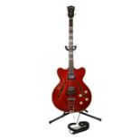 A Hofner Verithin 1963 bass guitar. No 199 Red Body with mother of pearl design to the headstock and