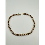 9ct GOLD RUBY & DIAMOND TENNIS BRACELET - APPROX 7" LONG
