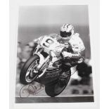 DOOHAN: A black and white image of Mick Doohan racing a Honda NSR500. Doohan signature