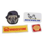 CLOTH BADGES: Four cloth badges including a ‘BRIDGESTONE’, ‘MICHELIN’, Shell & ‘NAM Pug’