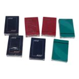 A collection of seven sealed Cathay Pacific Airways promotional playing card decks
