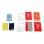 A collection of vintage promotional playing card decks from defunct international carriers