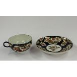 Ceramics: a Worcester tea cup and saucer, c.1760-70, painted with panels of Oriental flowers and