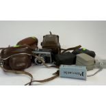 Cameras: a Voigtlander Vito C, a Braun Paxette and a Yashica Mat TLR camera, all cased, together