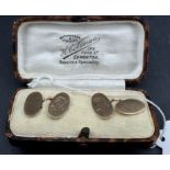 Jewellery: a pair of boxed gentleman's yellow metal chain cufflinks, each panel marked 9ct and