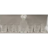 Glass: a set of six Baccarat cut glass tumblers and a decanter and stopper, cut with a stylised