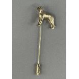 Jewellery: Yellow metal stick pin terminated with the figure of a dog, indistinctly marked,
