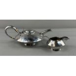 Silver: an Arts and Crafts style planished teapot by John Round, Sheffield 1905, of broad conical