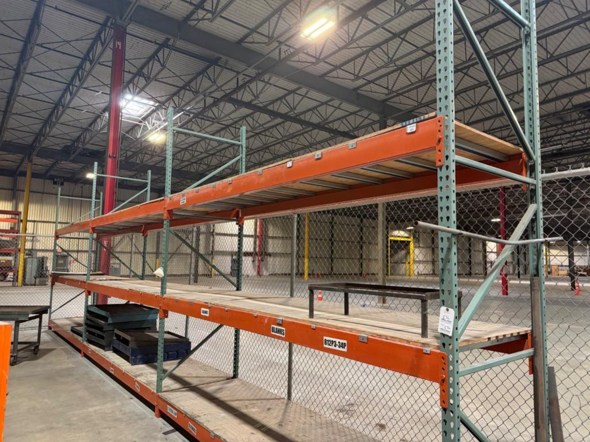 This lot includes seven sections of pallet racking, each standing 12 ...