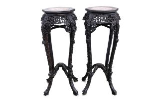 A PAIR OF MARBLE INSET HARDWOOD JARDINIERE STANDS