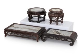 A GROUP OF FOUR MARBLE INSET STANDS