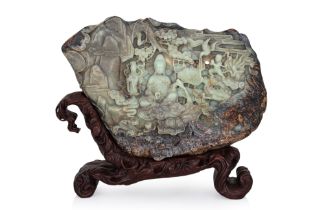 A LARGE CARVED CELADON AND RUSSET JADE BOULDER