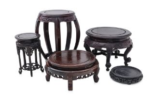 A GROUP OF FIVE CIRCULAR HARDWOOD STANDS