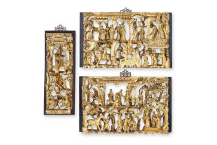 THREE CARVED AND GILT WOOD PANELS
