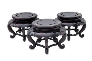 A SET OF THREE MOTHER OF PEARL INLAID HARDWOOD STANDS