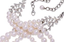 A TIFFANY & CO. THREE-ROW FRESHWATER PEARL AND SILVER OLIVE LEAF NECKLACE
