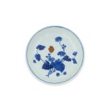 A BLUE AND WHITE PEONY DECORATED DISH