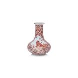 AN IRON RED 'MYTHICAL BEAST' DECORATED BOTTLE VASE
