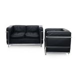 A BLACK LEATHER AND CHROME SOFA AND CHAIR IN THE MANNER OF LE CORBUSIER