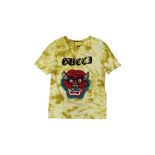 GUCCI - A YELLOW TIE-DYE COTTON T-SHIRT WITH EMBROIDERED MASK MOTIF