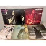 A collection of sixteen vinyl LP records including Rory Gallagher, Neil Young, Tina Turner, etc.