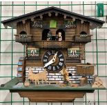 A German Black Forest style triple weight cuckoo clock