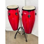 A pair of Stagg conga drums, 73cm h, with stand