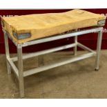 A beech butchers block on steel base