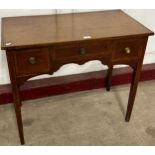 A George III inlaid mahogany writing table