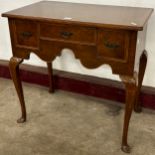 A George II style walnut lowboy
