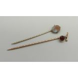 A Czech saphiret stick pin, and a 9ct gold stick pin set with a garnet, 1g