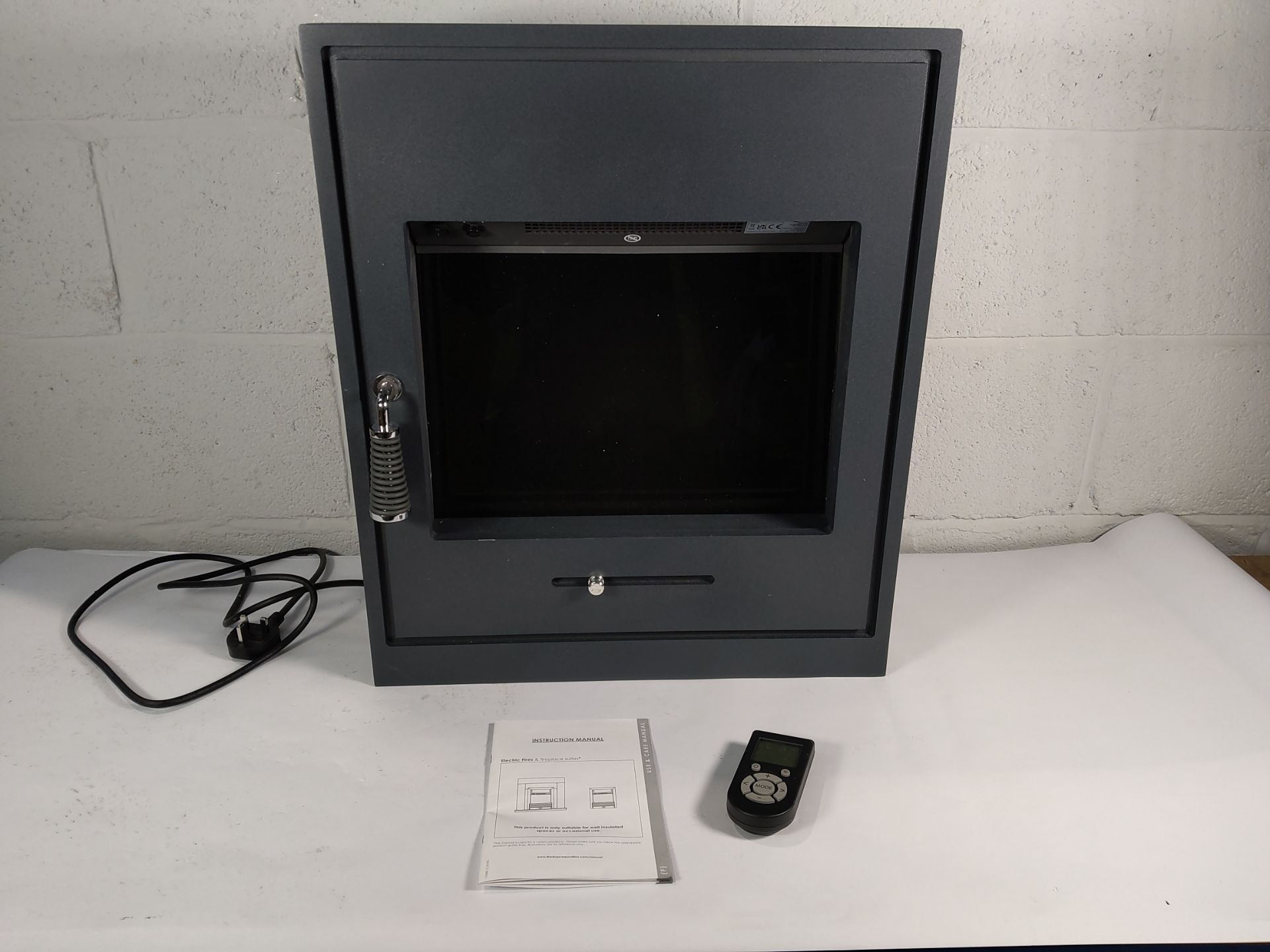 Pre-owned Adam 2kW Oslo Inset Stove with remote control. Some light marks.