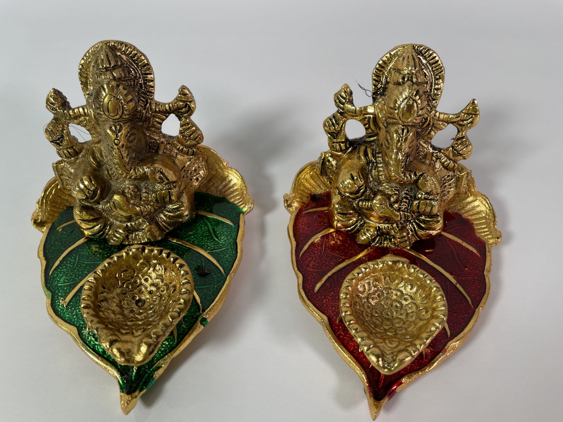 Twenty five as new small metal idols of the Hindu diety Lord Ganesha.