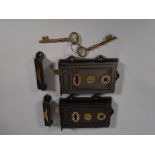 Two pre-owned cast iron and brass Davenport Rim locks and two keys.