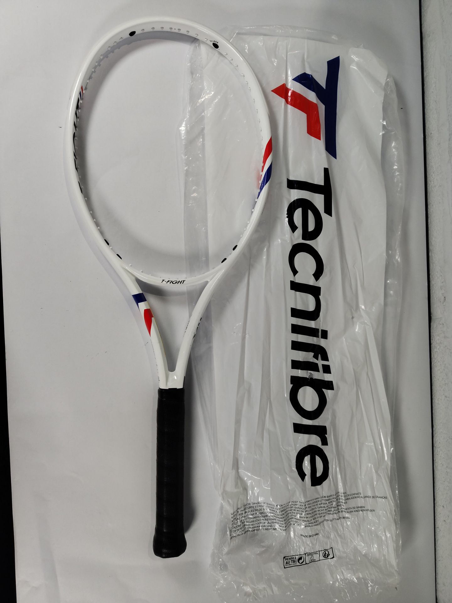 A Technifibre T-Flight 300 unstrung tennis racket (Note: racket has some minor damage and has been p