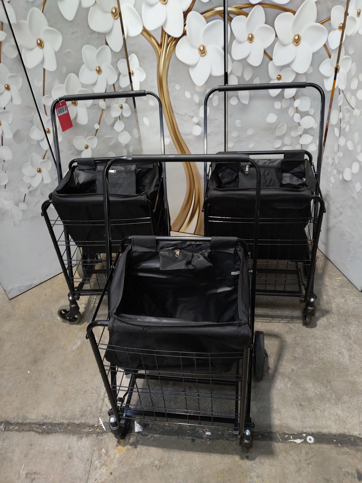 Three pre-owned Rocklands folding shopping trolleys.