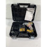 An as new Dewalt 18v brushless compact combi drill with a battery and charger.