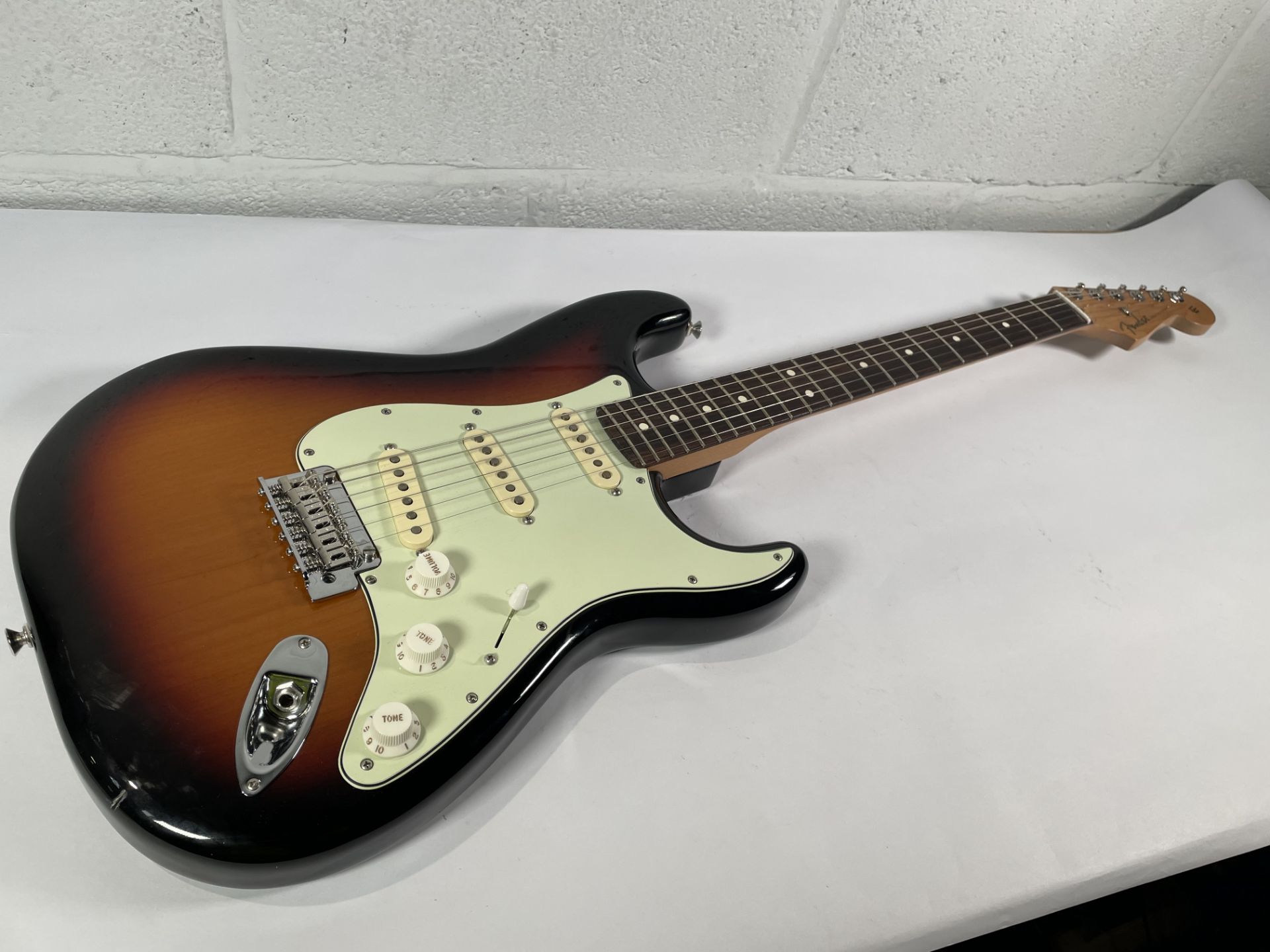 A Fender Stratocaster (probably Player II) with 3 colour sunburst and mint guard, SN: MXS24049572 (i